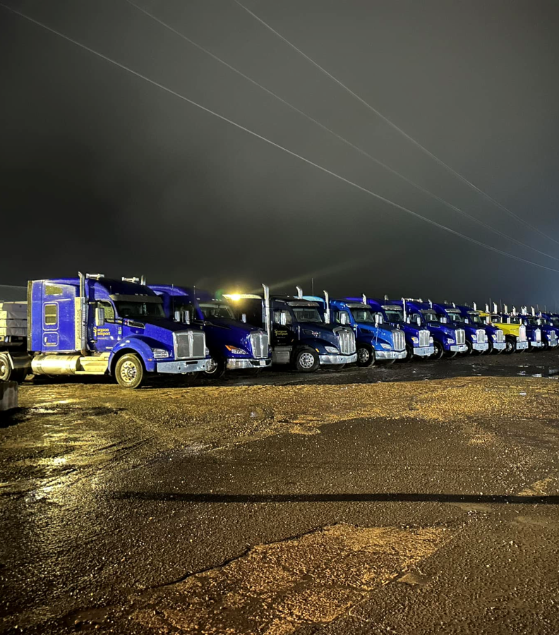 Sturgeon Transport’s blue trucks lined up at the yard